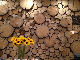 log end wood accent wall natural